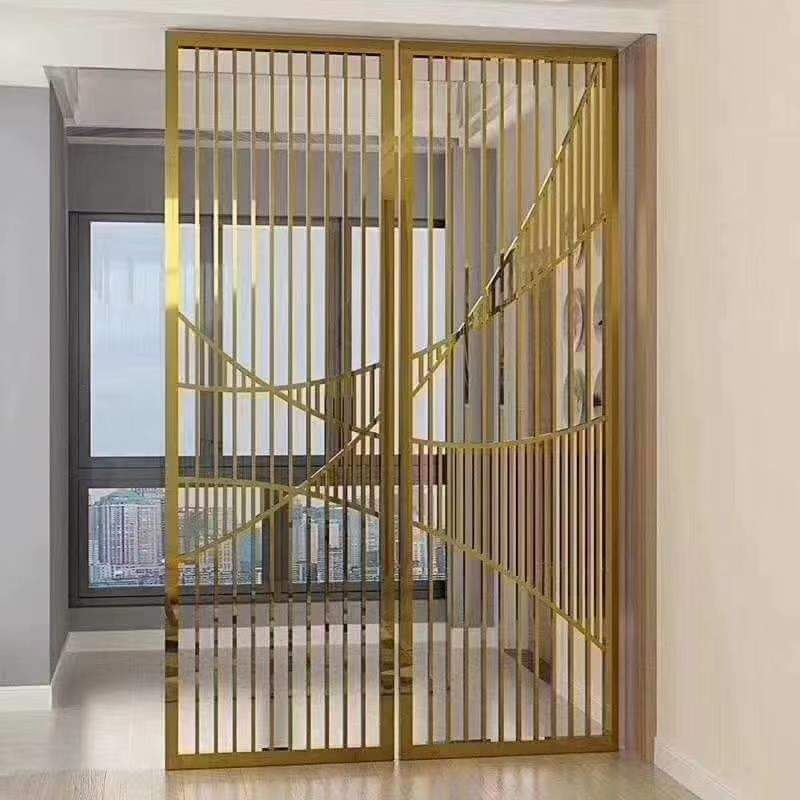 a gold metal room divider with a geometric pattern.
