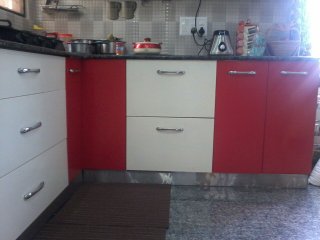 Modern L-Shaped Modular Kitchens by Karvi Interio